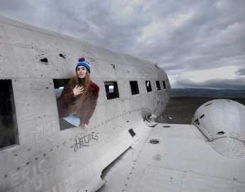 Anna Marie Tendler posing for a photo with plane 