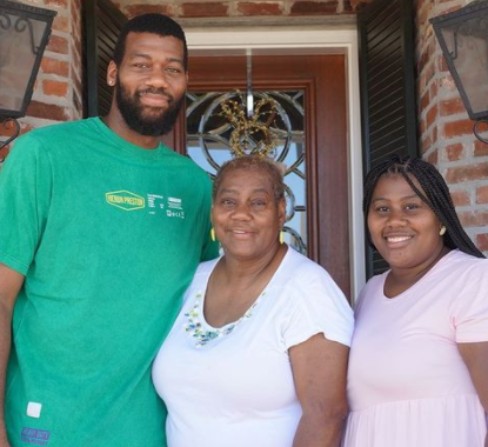 Picture of Greg Monroe with his mothers