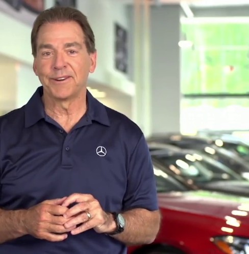 Nick Saban Posing in front of car