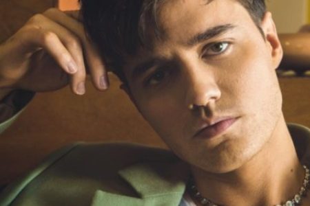 Anthony De La Torre posing in his car