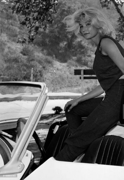 Yvette Mimieux posing in car