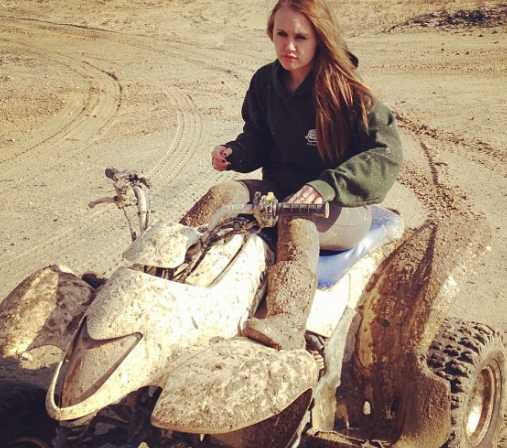 Jordan Cashmyer posing in her vehicle