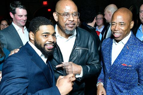 Jordan Coleman with his father in red carpet