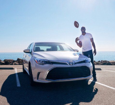 Father of Atkin Owen, Terrell Owens posing with car