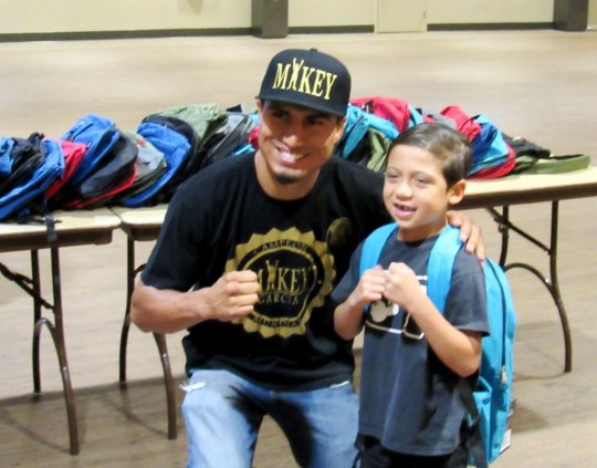 Mikey Garcia posing with son