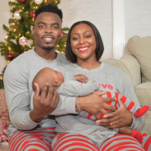 Monica Wright with her husband and child