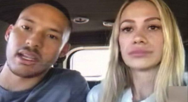 Daniella inside her car with her husband