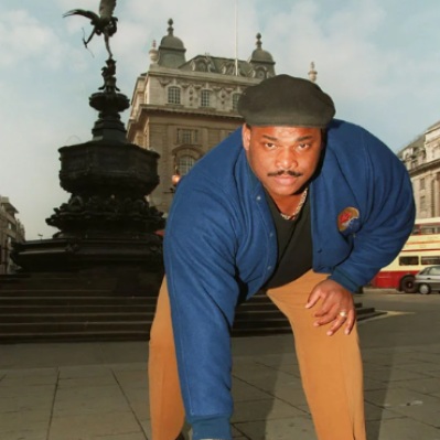 William Perry picture infront of the building