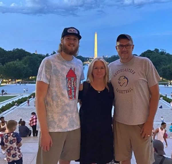 Brady Manek with his father and mother