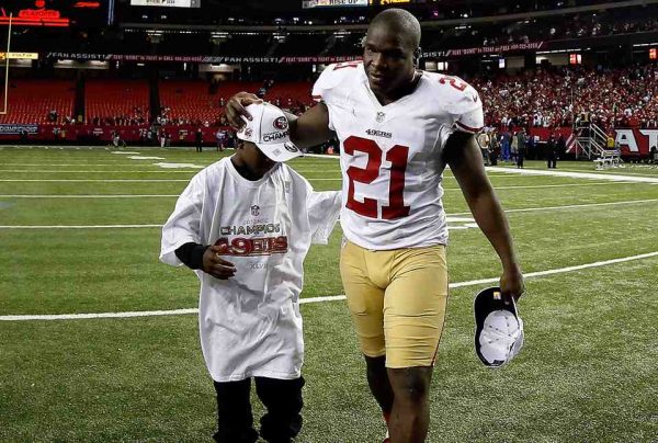 Frank Gore with his son