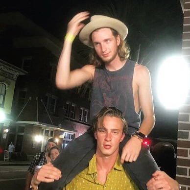 Drew Starkey posing with his friend