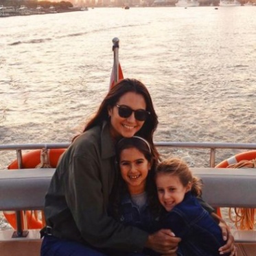 Emma Heming Willis posing in teh Yacht with her childrens