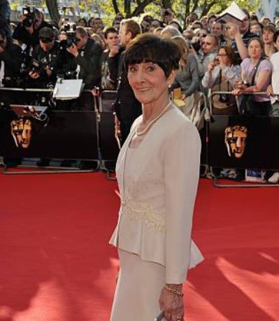 Robert Arnold's wife posing on the red carpet