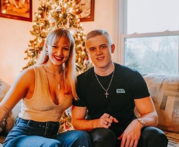 Joe Bartolozzi posing inside his lavish house with his friend