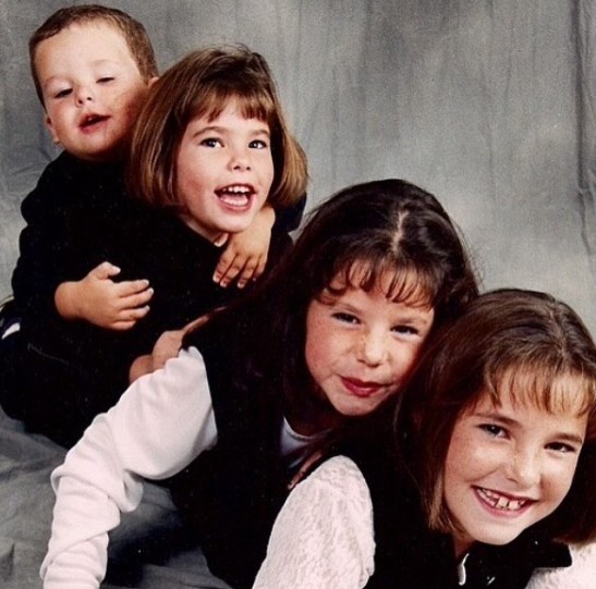 Kelsey Plum with her brother and sisters