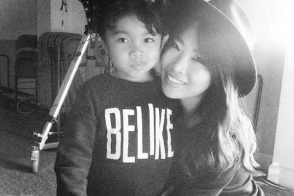 Jae Lin posing with son 