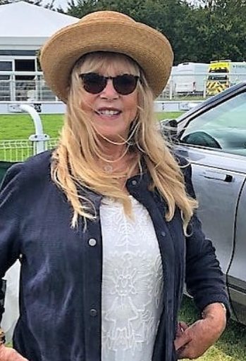 od Weston's wife posing besides the car