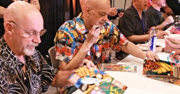 George Perez doing art in the frame