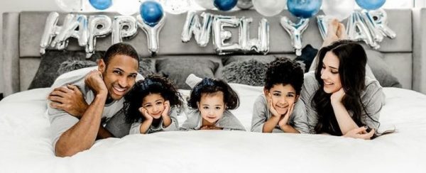 Amelia Vega with her husband and kids