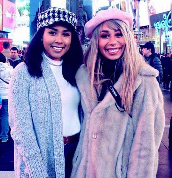 Eva Gutowski posing with sister