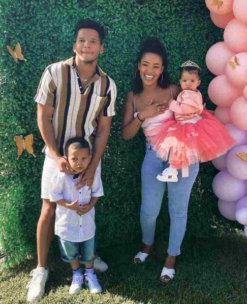 Jason Noah with his girlfriend and children