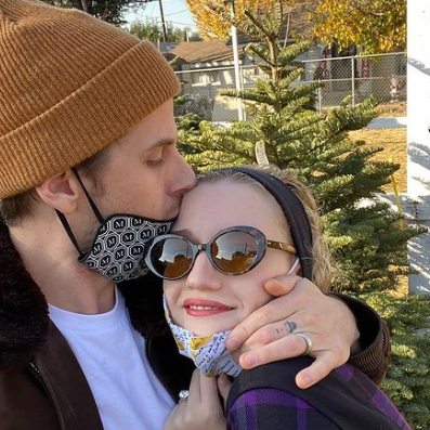 Mark Foster posing with his wife, Julia Garner 