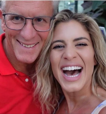 Kendall Toole posing with her father