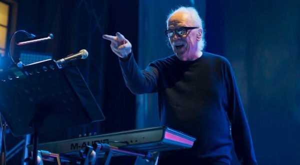 Sandy's husband John Carpenter singing in the stage