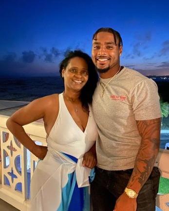 Jonathan Owens posing with his mother