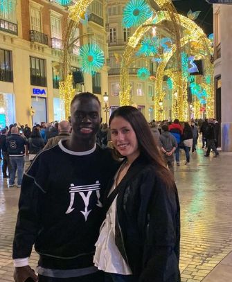 Awer Mabil with his girlfriend
