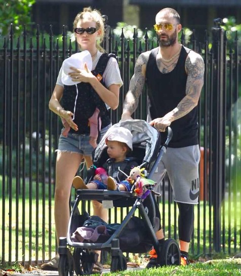 Behati Prinsloo with her husband and daughters