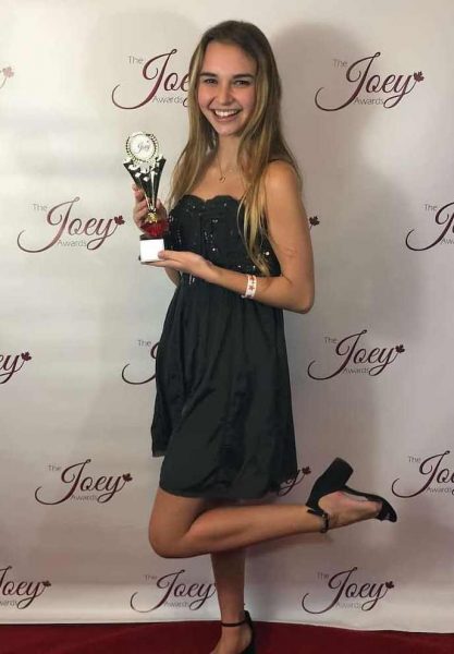 Nikki Roumel with her award