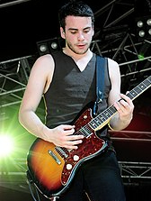 Taylor York in the frame with his guitar