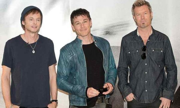 Morten Harket with his band members, A-ha