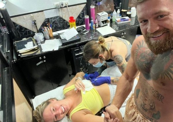 Dee Devlin getting tattoo