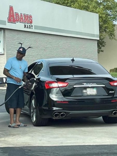 Coolio with his car at a gas station
