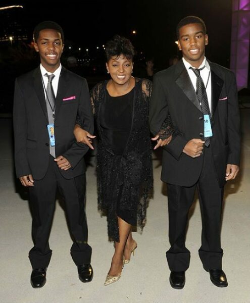 Anita poses with her sons