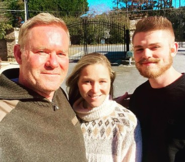  Michael Holmes posing with his son and daughter 