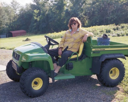 Cathy Horyn posing with tractor on the frame